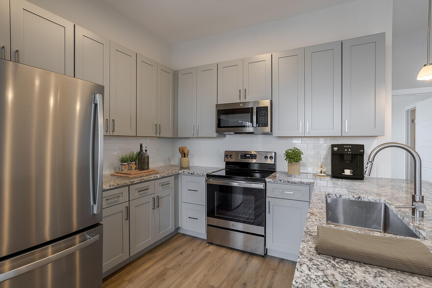 Kitchen with Stainless Steel Appliances - Destination at Arista Apartments