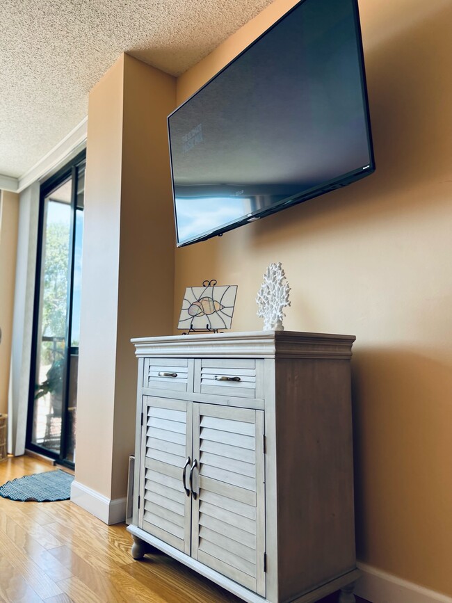 Large Television on the wall for comfortable viewing - 6219 Palma Del Mar Blvd S