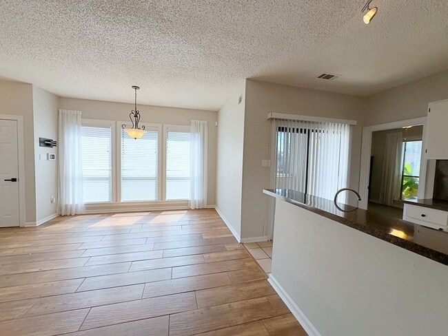 Building Photo - Welcome to this charming 2-bedroom, 2-bath...