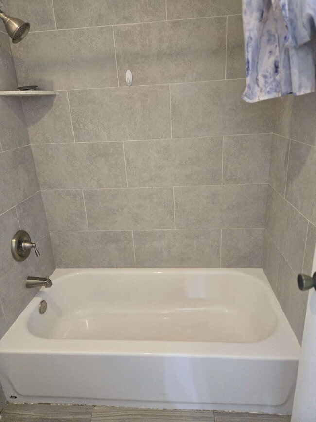 Building Photo - A spacious 3-bed, 2-bath condo is convenie...