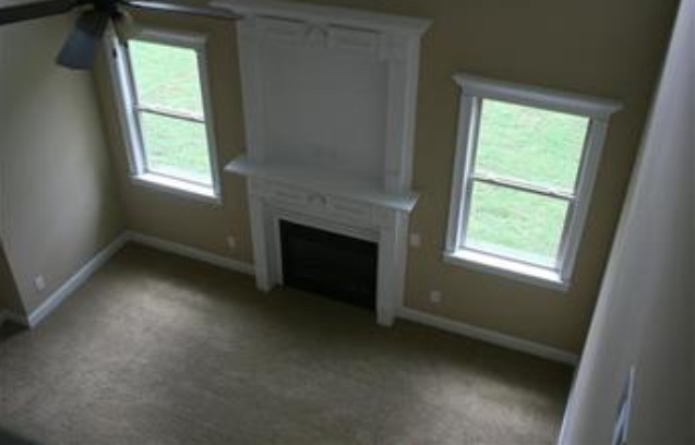 View of formal living room as seen from upstairs cat walk. - 319 Haywood Dr