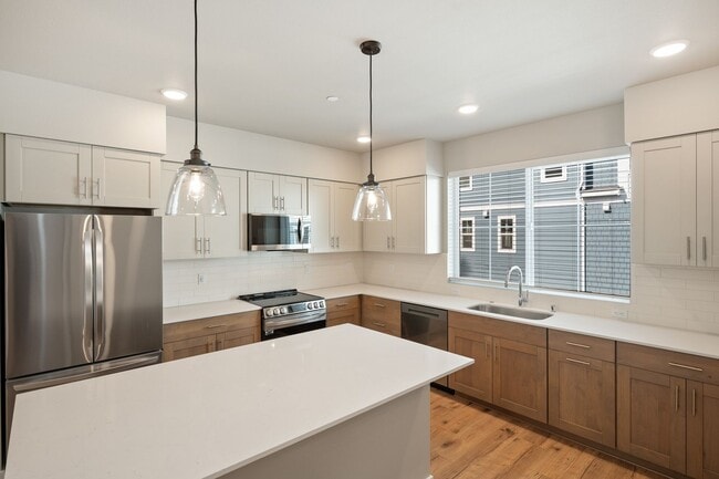 Building Photo - NEW CONSTRUCTION – Stylish 4-Bedroom Townh...
