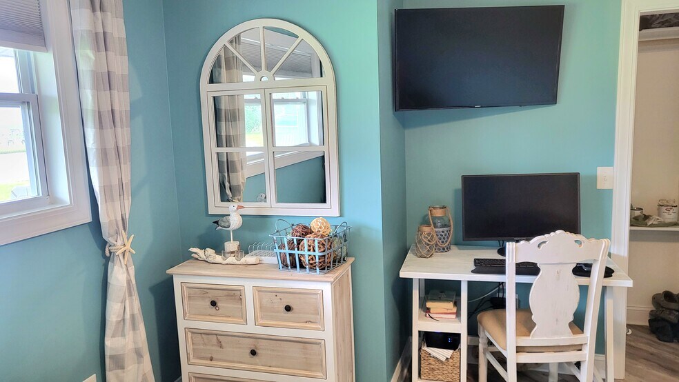 Dresser and desk, bedroom smart TV - 109 Cedar Ln
