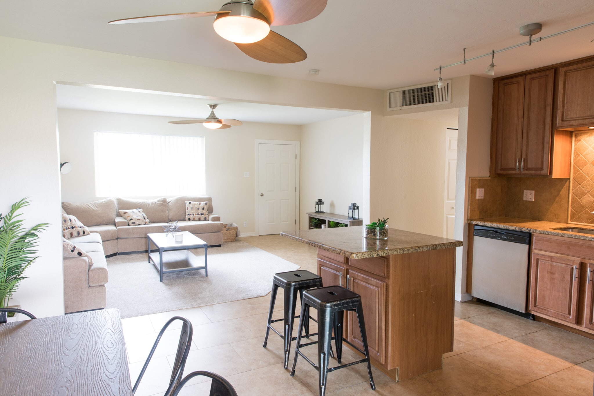 Shared Kitchen and living room open layout space - 7561 E Belleview St