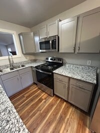 Building Photo - Updated Four Bedroom/Two Bath/Two Car Carport/Fenced/Storage Bldg