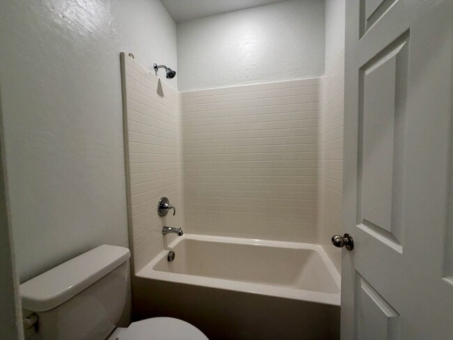 Building Photo - GATED 3 BED 2.5 BATH TOWNHOME WITH 2-CAR GARAGE, COVERED PATIO & COMMUNITY POOL