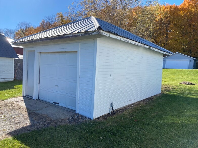 1.5 car Garage, lighting inside and outside front and back. - W4493 Spruce Dr