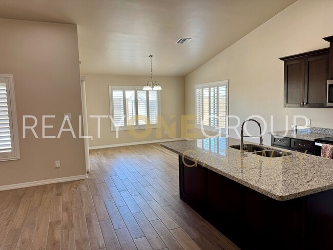 Building Photo - Enjoy those Arizona Sunset in this Three Bedroom Two Bath Home full of upgrades !!