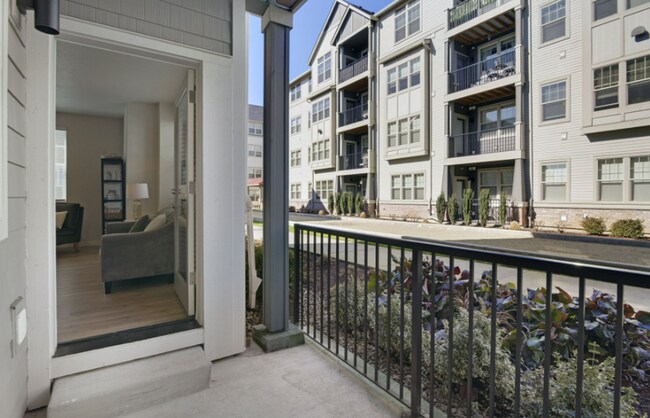 Building Photo - Modern Ground-Level Condo in River Terrace...