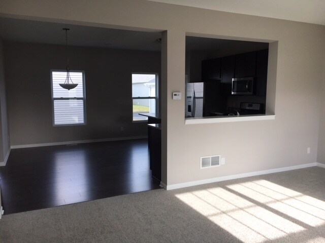 Living room looking into kitchen - 2571 W 127th Pl