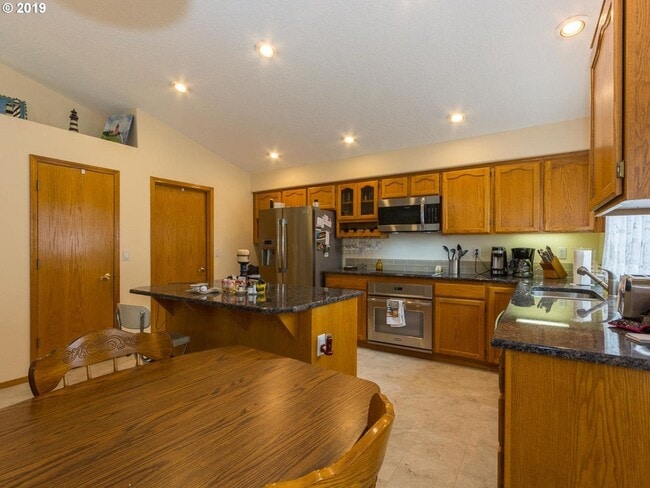 Building Photo - Charming 4-Bed, 2-Bath Home with Vaulted Ceilings, Dual Fireplaces & Serene Outdoor Spaces