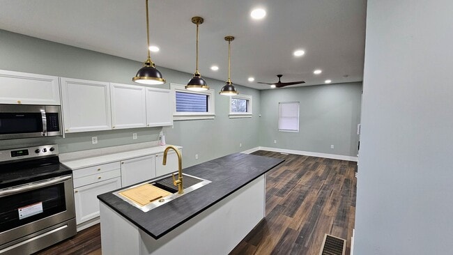 Building Photo - Stunning Renovation Ready for Your Finishing Touches!