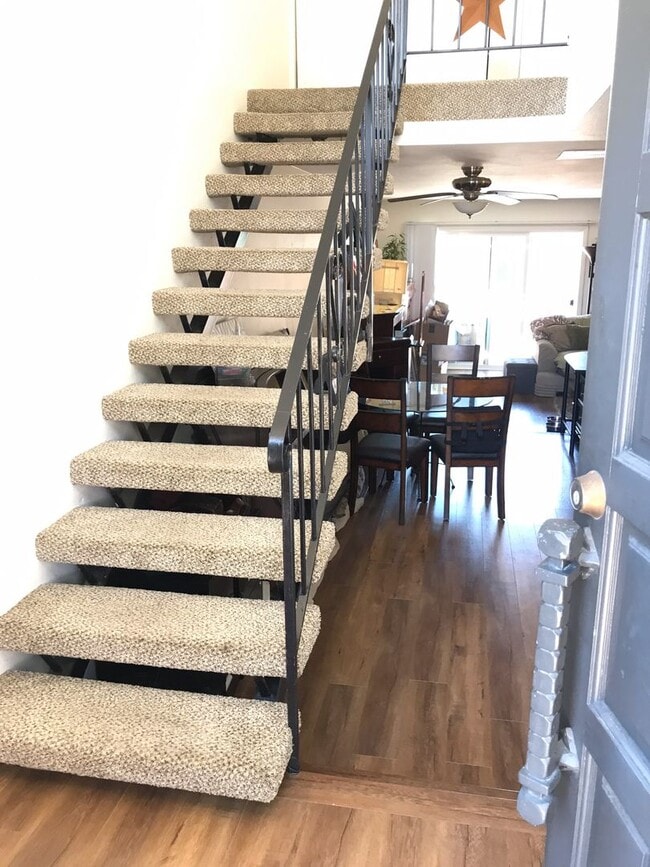 Building Photo - Beautiful Townhome with large fenced back patio, second story balcony, and two covered parking spots