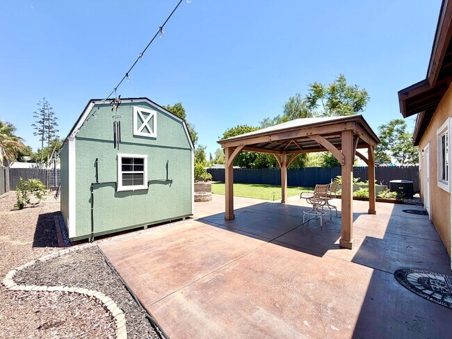 Building Photo - Beautifully Renovated 4 Bedroom Home with INCLUDED Solar, Large Backyard & Gazebo