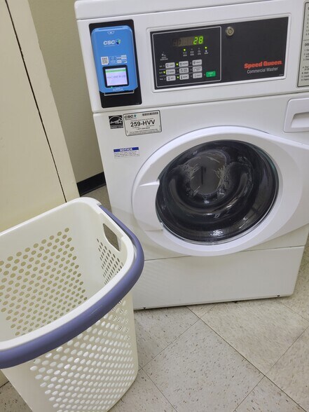 Laundry room on 7th floor with washer, dryer, and garbage chute (mud sinks on alternating floors) - 4944 Cass St