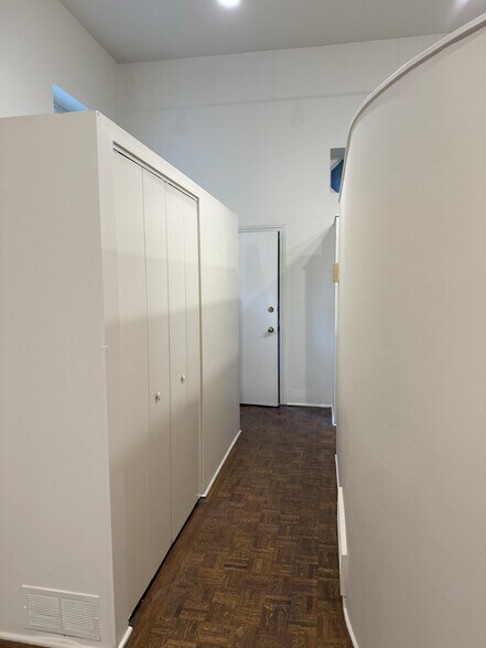 hallway to kitchen with closet - 2059 N Clifton Ave