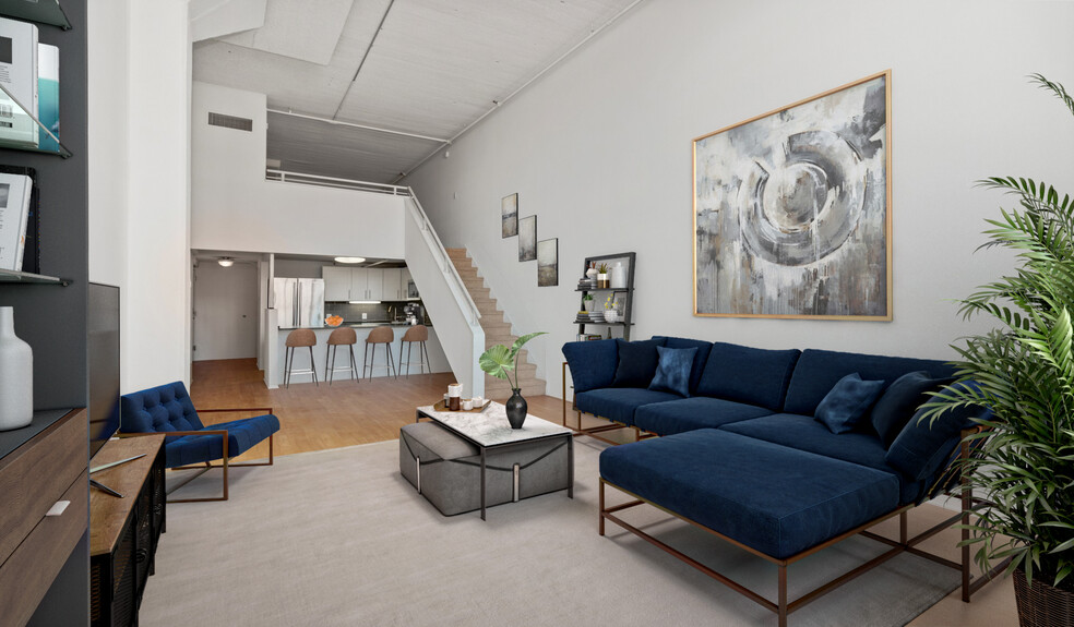 Spacious living room provides ample natural light - The Riverloft