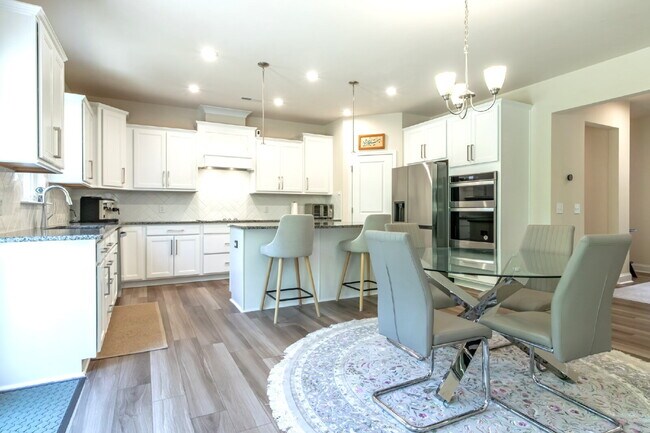 Building Photo - "Discover Spacious Living: 5-Bedroom Craftsman Home in Gated and Amenity-Rich Bretagne with Top-R...