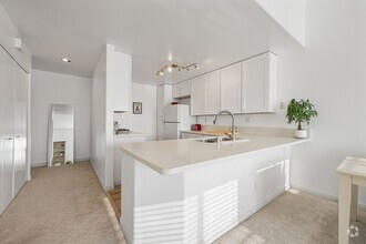 Building Photo - Thoughtfully Remodeled Condo W/ Attached G...