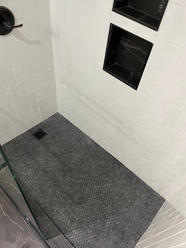 New shower floor - 125 E 1st Ave