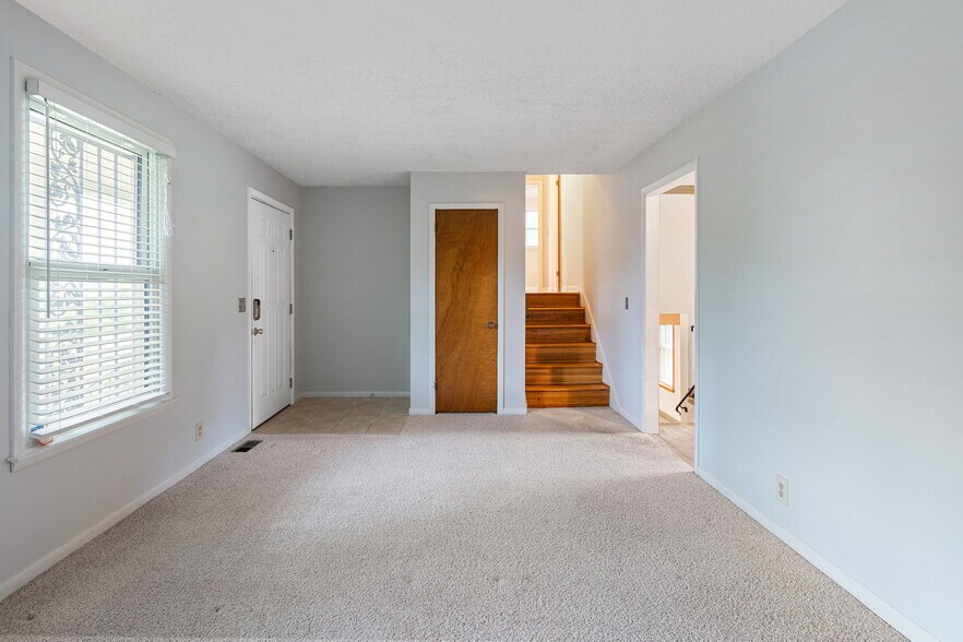 Living room with stairs to bedrooms - 3841 Dubois Dr