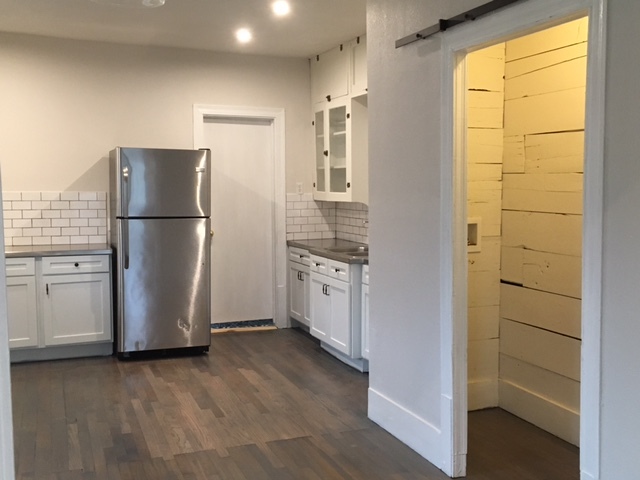 Utility room with barn door - 1133 W Lynwood Ave