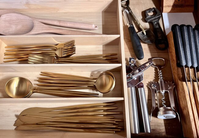 Brass flatware along with everything else a well-stocked kitchen should have. kitchen should - 2424 Stevens Ave