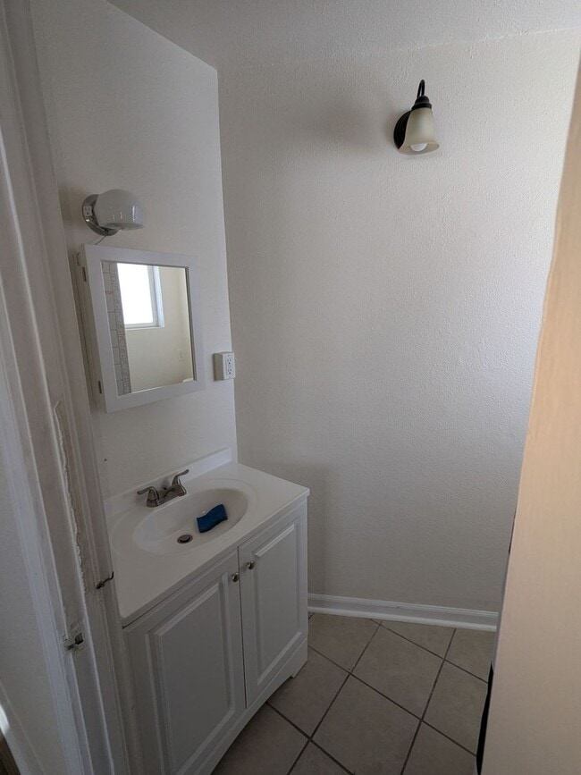 Building Photo - Ground Level 2 Bedroom, 2 Bath apartment. New flooring and paint. Tenant pays electric and natura...