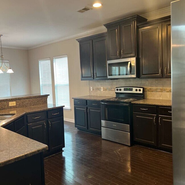 Building Photo - This beautiful 4 bedroom, 2.5 bath home in the highly sought-after Palmetto Pointe neighborhood h...