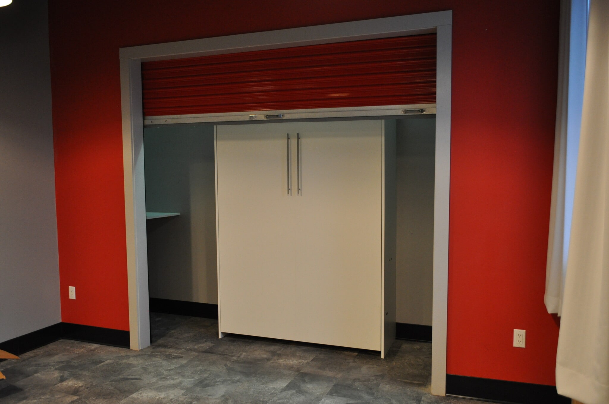 Murphy Bed exposed with hidden storage area on either side - 208 W Broadway St