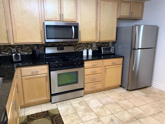 Building Photo - Meridian-FURNISHED 2 BDR /2 BATH + Den Lux...