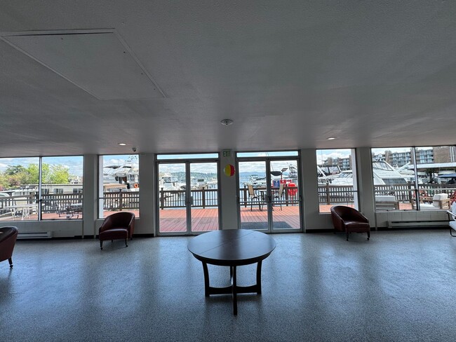 Building Photo - Gorgeous Condo in Seward Park with 2 Parking Spaces, Steps Away from Pool with Water View!