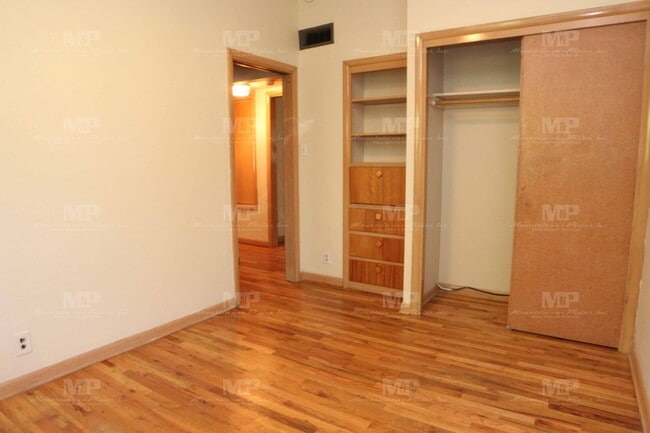 Building Photo - Three Bedroom with Covered Parking Spot!