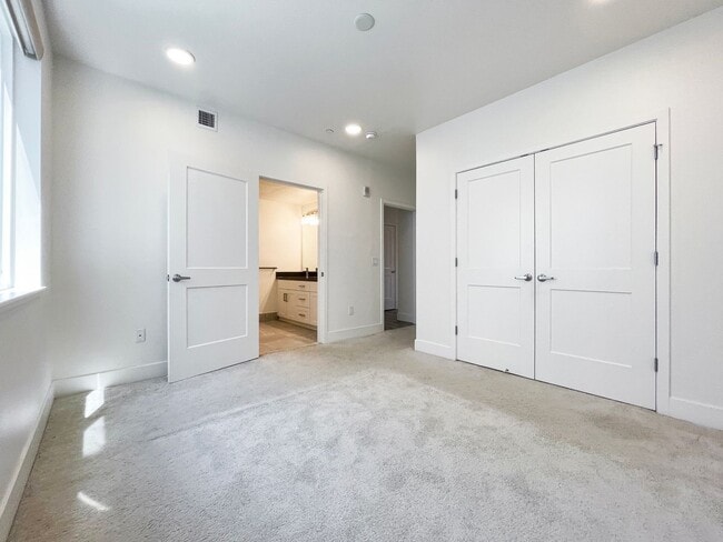 Building Photo - Modern 2BD Fremont Condo – EV Charger, Balcony, & Walk to BART