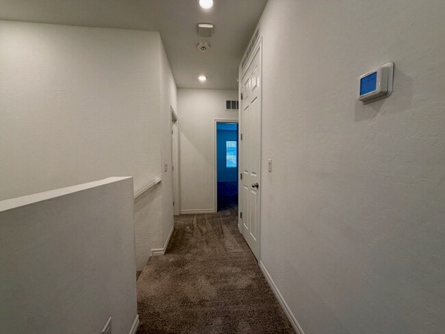 Building Photo - GATED 3 BED 2.5 BATH TOWNHOME WITH 2-CAR GARAGE, COVERED PATIO & COMMUNITY POOL