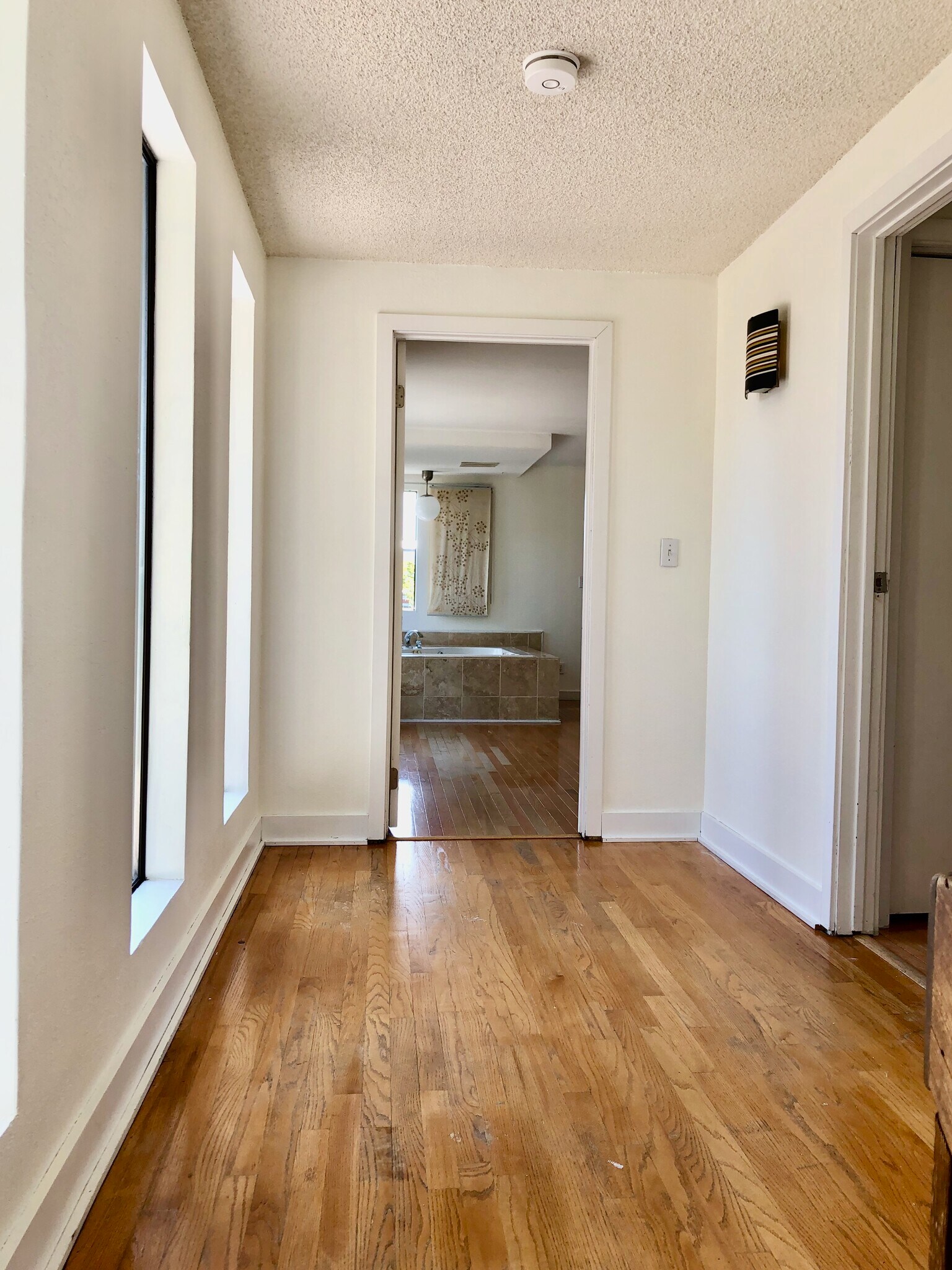 Upstair hall to primary and guest bedrooms - 10249 33rd Ave sw