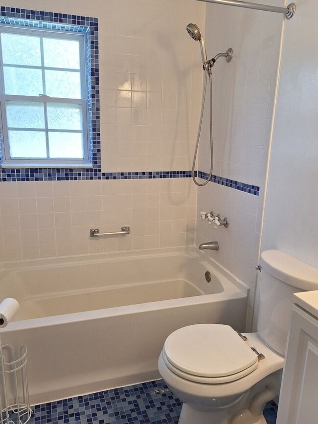 Building Photo - Cute white cottage with white picket fence & Huge deck off back door!