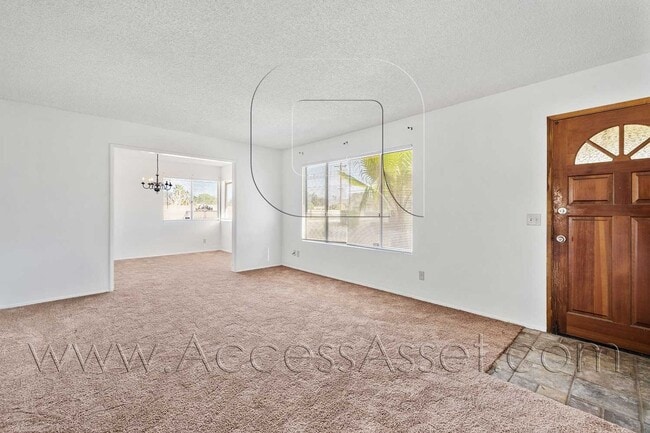 Building Photo - Single-Story 3 Bed with Covered Patio & Gated Yard