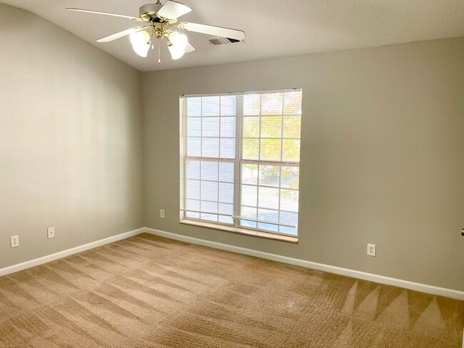 Building Photo - Welcome to this charming brick townhome in...