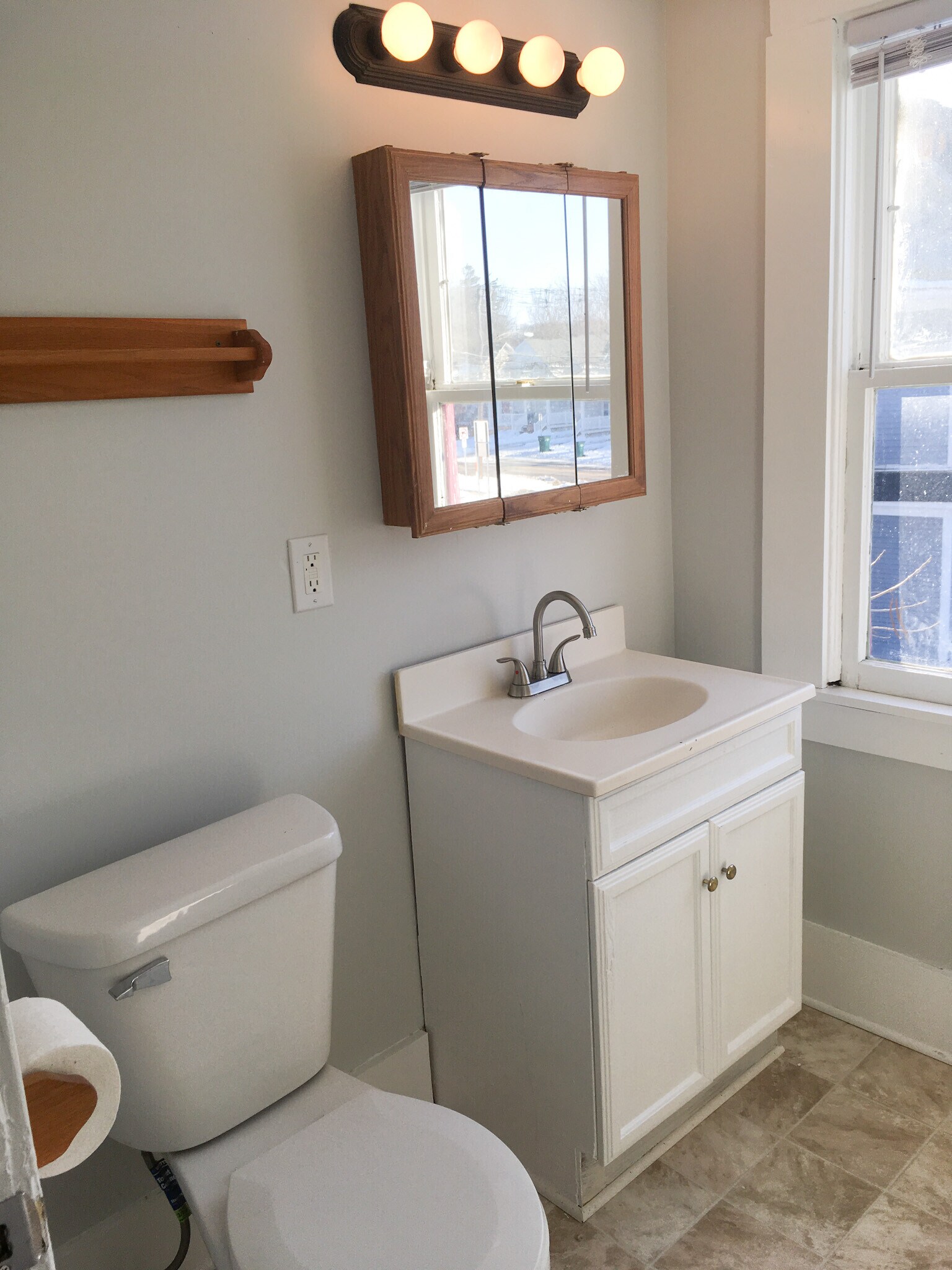 Bathroom toilet and sink - 219 W Oakland Ave