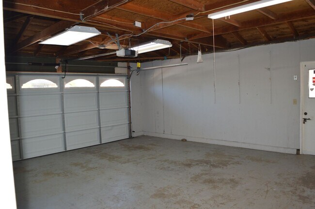 Building Photo - Four Bedroom, Two Bathroom Single Story Home With Two Car Garage