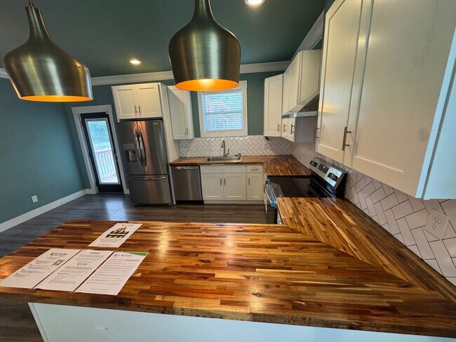 Building Photo - Modern Bungalow Charm: Designer Finishes & Expansive Backyard Living!