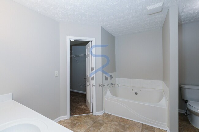 Building Photo - Move in before February 15th and choose your reward: a $250 Amazon Gift Card or a 55" Smart TV!