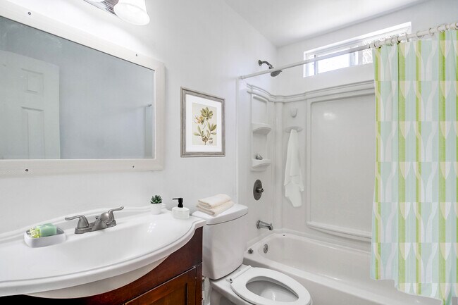 Our clean, fully stocked bathrooms comes w/ soap, shampoo, plush towels, & hair dryer - 2304 E 14th St