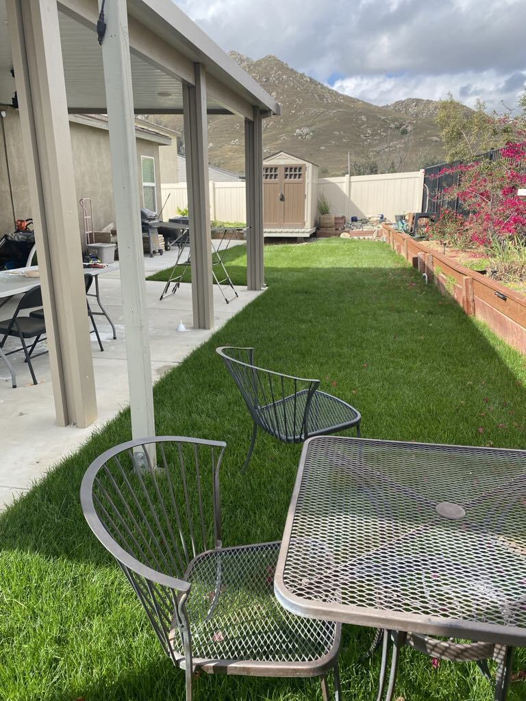 grass backyard with patio - 7893 Boot Straps Ct