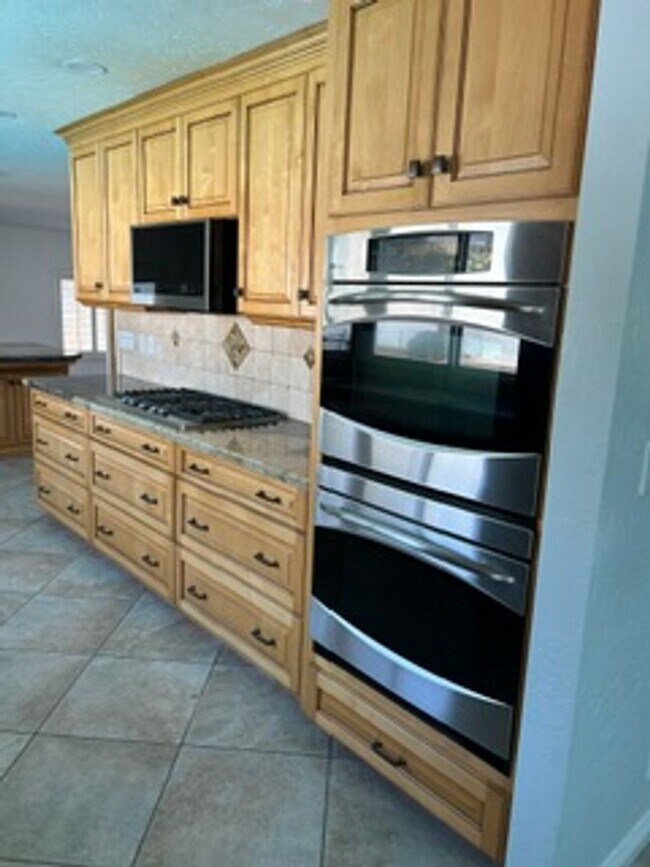 Building Photo - Spacious 4BR Home with Gated Pool, Chef’s Kitchen & 3-Car Garage