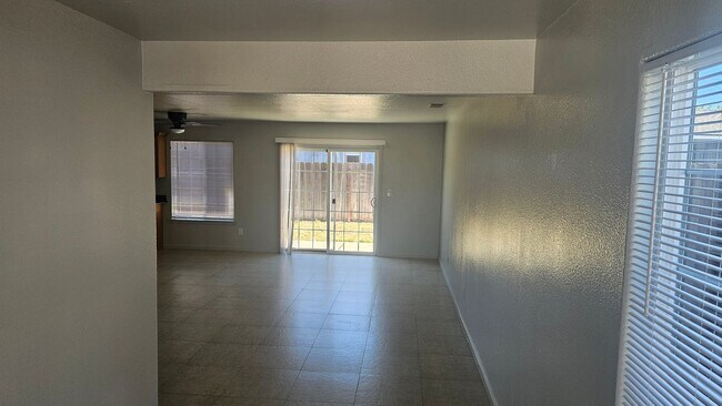Building Photo - Three Bedroom Two and a half bath house, 2 car garage, central air. Available now.