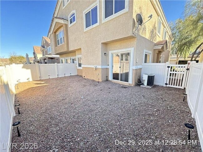 Building Photo - Cozy Gated Townhome with Private Yard, 2-Car Garage & Community Pool!