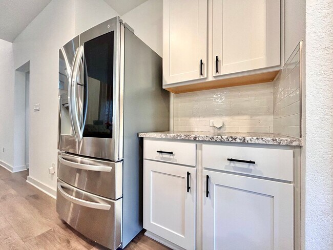 Building Photo - Inviting 4-Bed, 2.5-Bath Home with High Ceilings and Covered Deck