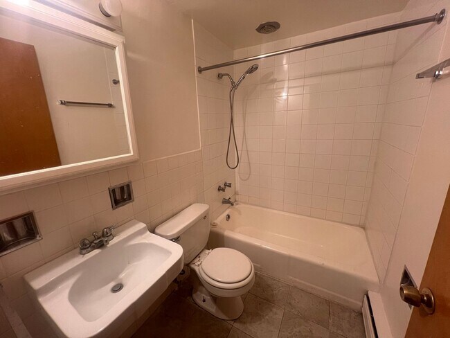 Building Photo - Mid-Century Modern 1-Bed + Den with Exposed Brick